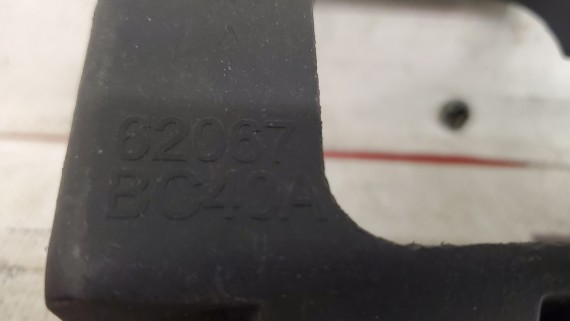 Кронштейн омывателя фары левой Nissan Micra K12e 2002-2010
